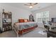 Comfortable bedroom with ample natural light, a ceiling fan, and a dedicated workspace at 331 Parkview Manor Dr, Tucker, GA 30084