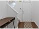 Entryway features modern console table and stairs, highlighted by neutral walls at 331 Parkview Manor Dr, Tucker, GA 30084