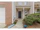 Inviting front porch and walkway enhance this townhome's curb appeal with fresh landscaping at 331 Parkview Manor Dr, Tucker, GA 30084