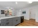 Open kitchen boasts a large island with white countertops, gray cabinets, and stainless steel appliances at 331 Parkview Manor Dr, Tucker, GA 30084