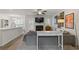 Comfortable living room with fireplace, neutral walls, and view into the dining and kitchen area at 331 Parkview Manor Dr, Tucker, GA 30084