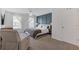 Spacious main bedroom with a decorative accent wall, ceiling fan, and large windows at 331 Parkview Manor Dr, Tucker, GA 30084