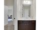 Hall bathroom featuring a vanity with a white countertop and a large mirror at 3360 Camellia Ln, Suwanee, GA 30024
