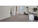 Bedroom featuring neutral carpet, good natural light, and access to a bathroom at 3360 Camellia Ln, Suwanee, GA 30024