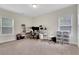 Neutral bedroom, well lit, with carpet and shelving for storage or decor at 3360 Camellia Ln, Suwanee, GA 30024