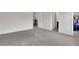 Bedroom with neutral carpet and open doorways at 3360 Camellia Ln, Suwanee, GA 30024