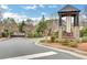 Gated community entrance with 'Wentworth Manor' sign amid manicured landscaping at 3360 Camellia Ln, Suwanee, GA 30024
