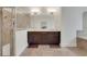 This main bathroom has double sinks, a bathtub, a shower, and tile flooring at 3360 Camellia Ln, Suwanee, GA 30024