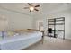 This main bedroom has neutral walls, beige carpet, ceiling fan, and is well lit at 3360 Camellia Ln, Suwanee, GA 30024
