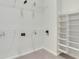 This walk-in closet features wire shelving, hanging rods, and beige carpet at 3360 Camellia Ln, Suwanee, GA 30024