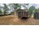 View of the backyard featuring a home with siding, a wooden deck, patio, and a wooden fence at 100 Waters Edge Dr, Locust Grove, GA 30248