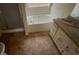 Full bathroom featuring granite countertops, vinyl floors and bathtub at 100 Waters Edge Dr, Locust Grove, GA 30248