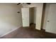 Bedroom featuring neutral walls, carpet floors, and an open closet at 100 Waters Edge Dr, Locust Grove, GA 30248