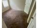 Bedroom featuring neutral walls, carpet floors, and natural light from a window at 100 Waters Edge Dr, Locust Grove, GA 30248