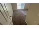 Empty bedroom featuring neutral walls, carpet floors, and natural light from a window at 100 Waters Edge Dr, Locust Grove, GA 30248