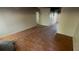 Spacious living room featuring wood floors and access to a hallway at 100 Waters Edge Dr, Locust Grove, GA 30248