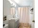 Compact bathroom features a modern vanity with a sleek sink and a shower with a curtain at 1380 Chalmette Ne Dr # 3, Atlanta, GA 30306