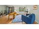 Bright living room featuring hardwood floors, blue accent chair, and French doors at 1380 Chalmette Ne Dr # 3, Atlanta, GA 30306
