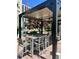 Outdoor patio with pergola covering a table and chairs next to a pool with lounge seating at 325 E Paces Ferry Ne Rd # 410, Atlanta, GA 30305