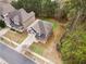 Beautiful home with a well-kept lawn, long driveway, and an inviting front porch at 3892 Trillium Wood Trl, Snellville, GA 30039