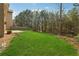 Serene backyard with lush greenery and mature trees, creating a private and inviting outdoor space at 3892 Trillium Wood Trl, Snellville, GA 30039