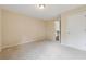 Bedroom featuring neutral carpeting, a ceiling light, and a staircase view at 3892 Trillium Wood Trl, Snellville, GA 30039