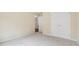 A bright bedroom with neutral carpeting and a double-door closet at 3892 Trillium Wood Trl, Snellville, GA 30039