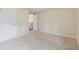 Spacious bedroom featuring neutral carpeting and a staircase view at 3892 Trillium Wood Trl, Snellville, GA 30039