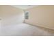 Bedroom featuring plush carpet and a bright window at 3892 Trillium Wood Trl, Snellville, GA 30039