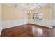 Elegant dining room with coffered ceilings, wainscoting, and hardwood floors at 3892 Trillium Wood Trl, Snellville, GA 30039