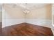 Spacious dining room with coffered ceilings, wainscoting, and rich hardwood floors at 3892 Trillium Wood Trl, Snellville, GA 30039