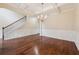 Dining room with coffered ceilings, beautiful lighting, and hardwood floors at 3892 Trillium Wood Trl, Snellville, GA 30039