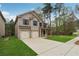 Beautiful home with a two-car garage, nice landscaping, and well-kept lawn at 3892 Trillium Wood Trl, Snellville, GA 30039