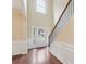 Welcoming foyer featuring beautiful hardwood floors, tall ceilings, and staircase at 3892 Trillium Wood Trl, Snellville, GA 30039