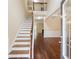 Elegant entryway with hardwood floors, staircase, and views of the living room at 3892 Trillium Wood Trl, Snellville, GA 30039