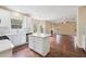 Eat-in kitchen with center island and view to the living room with fireplace at 3892 Trillium Wood Trl, Snellville, GA 30039