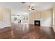 Open-concept living room with hardwood floors, fireplace and open access to kitchen at 3892 Trillium Wood Trl, Snellville, GA 30039