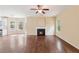 Open living room with hardwood floors, fireplace, and an open concept at 3892 Trillium Wood Trl, Snellville, GA 30039