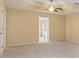 Main bedroom featuring plush carpet and a doorway to the bathroom at 3892 Trillium Wood Trl, Snellville, GA 30039