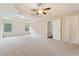 Main bedroom featuring a ceiling fan and windows for natural light at 3892 Trillium Wood Trl, Snellville, GA 30039