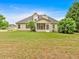 Extensive backyard with a screened porch offering a peaceful outdoor living area at 57 Craig Meadows Ln, Douglasville, GA 30134