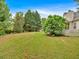 Spacious backyard with a combination of open lawn and shade trees, perfect for outdoor activities at 57 Craig Meadows Ln, Douglasville, GA 30134