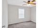 Comfortable bedroom with ceiling fan and window providing natural light at 57 Craig Meadows Ln, Douglasville, GA 30134