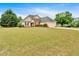 Well-maintained home with a spacious yard, featuring mature trees, a two-car garage, and classic suburban charm at 57 Craig Meadows Ln, Douglasville, GA 30134