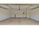 Spacious two-car garage with a concrete floor and white walls at 57 Craig Meadows Ln, Douglasville, GA 30134
