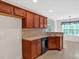 Well-equipped kitchen with wood cabinets and adjacent breakfast area with lots of natural light at 57 Craig Meadows Ln, Douglasville, GA 30134