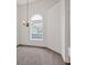 Inviting living room with large window and elegant chandelier at 57 Craig Meadows Ln, Douglasville, GA 30134