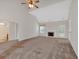 Large living room boasts a fireplace and vaulted ceilings, creating an open and inviting atmosphere at 57 Craig Meadows Ln, Douglasville, GA 30134