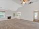 Bright and airy living room with a fireplace, large windows, and neutral carpeting at 57 Craig Meadows Ln, Douglasville, GA 30134