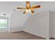 Large loft featuring a ceiling fan and bright natural light at 57 Craig Meadows Ln, Douglasville, GA 30134